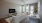 a living room with large widows