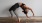 woman bending over backwards in an exercise studio